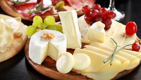 Cheese and salami platter with vegetable and herbs